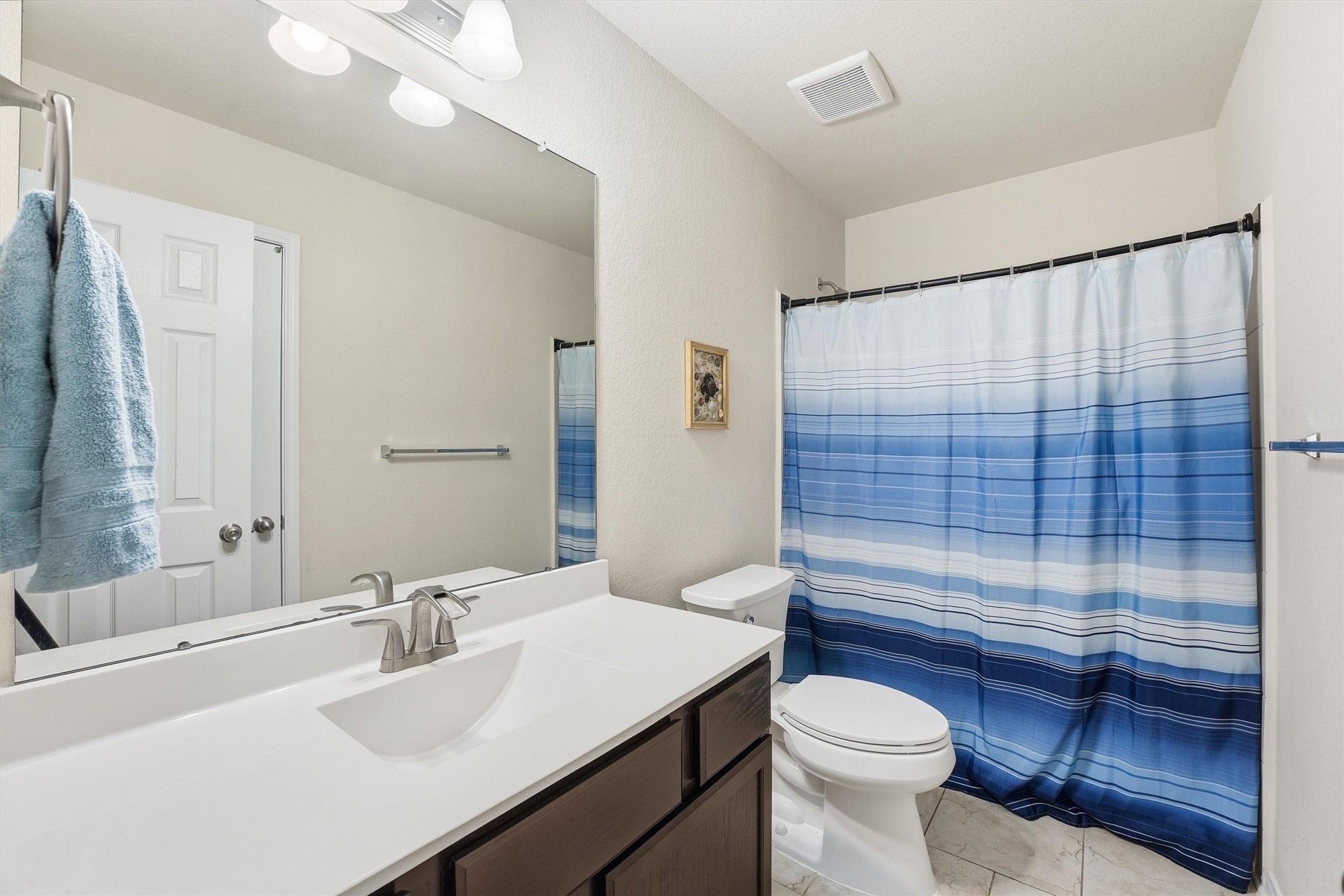 2115 Pacific Loon Lane Conroe, TX 77385 - Photo 13 of 26 a bathroom with a sink toilet and shower