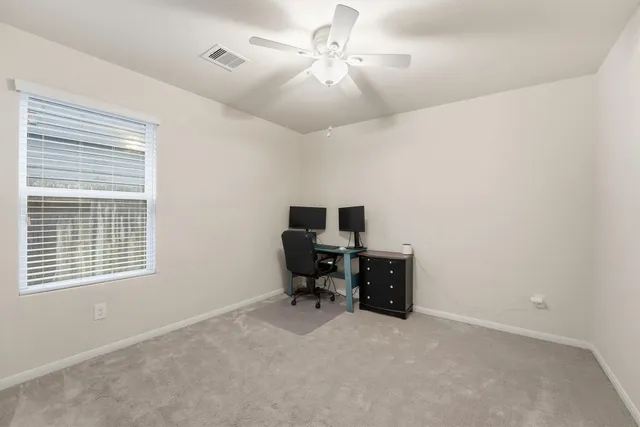 a workspace with furniture and a window