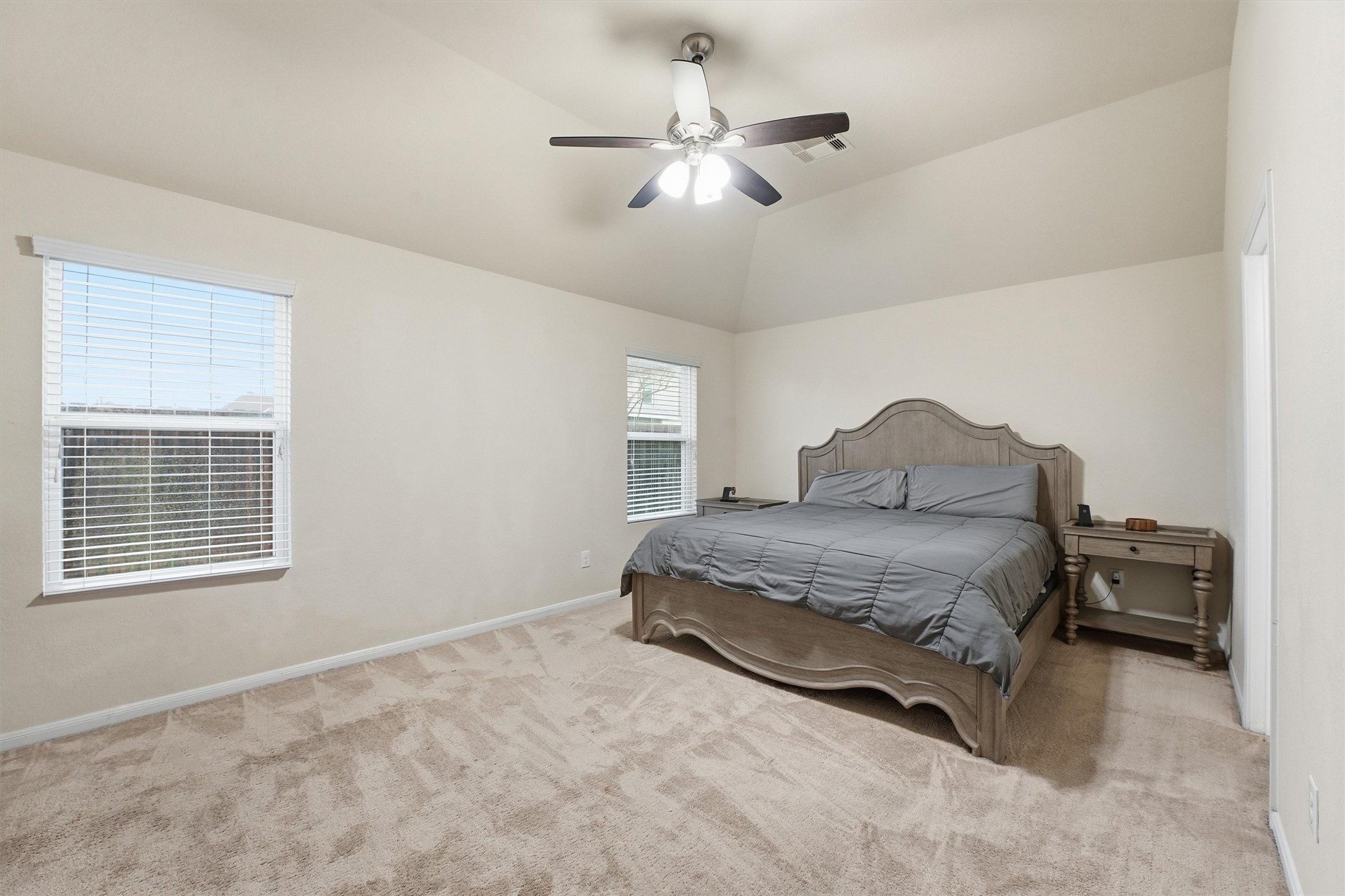2115 Pacific Loon Lane Conroe, TX 77385 - Photo 16 of 26 a bedroom with a bed and window
