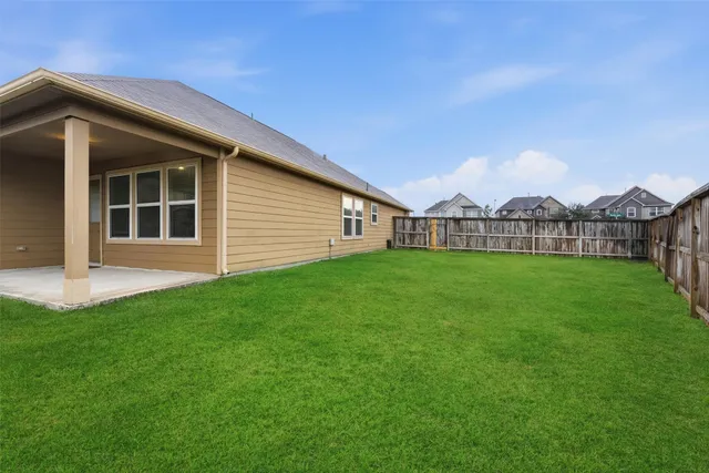 a view of a house with a back yard