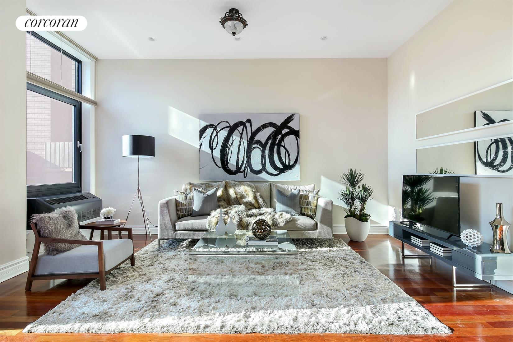 233 Pacific Street, Unit 2D Brooklyn, NY 11201 - Photo 1 of 1 a living room with furniture and a flat screen tv