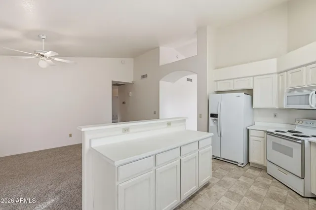 a kitchen with a refrigerator a sink and dishwasher