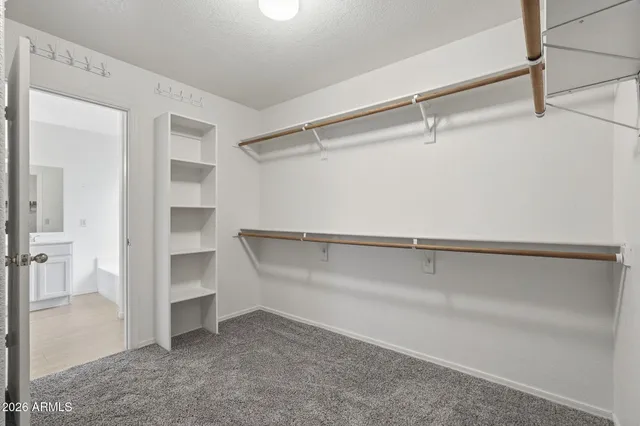 a view of an empty walk in closet