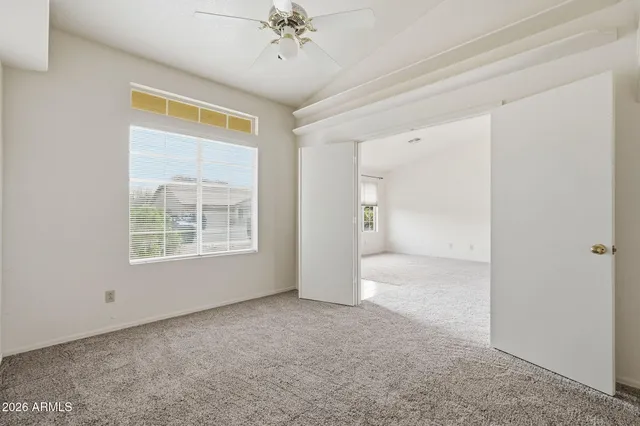 a view of an empty room with a window
