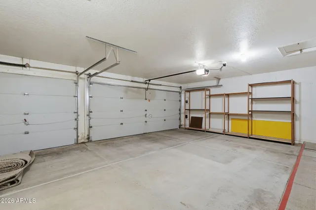 an empty room with ceiling fan