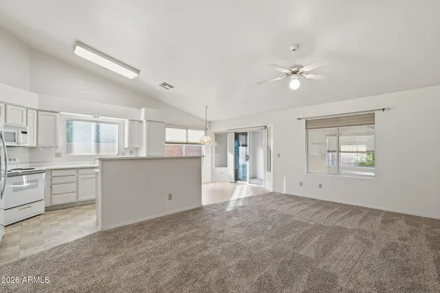 a view of a kitchen with a sink and cabinet area