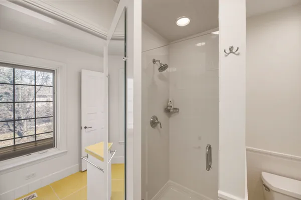 a bathroom with a tub and shower