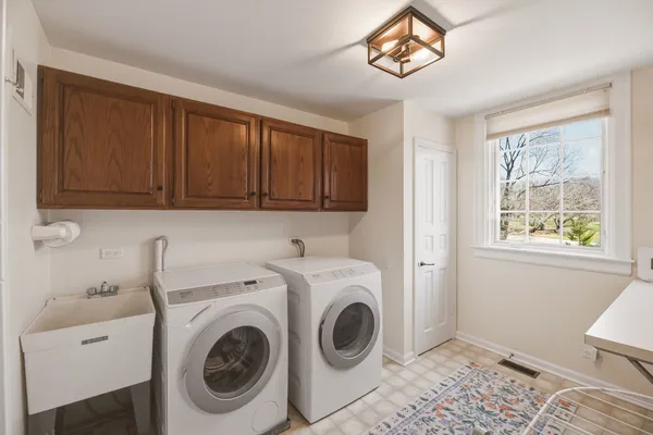 a utility room with dryer and washer