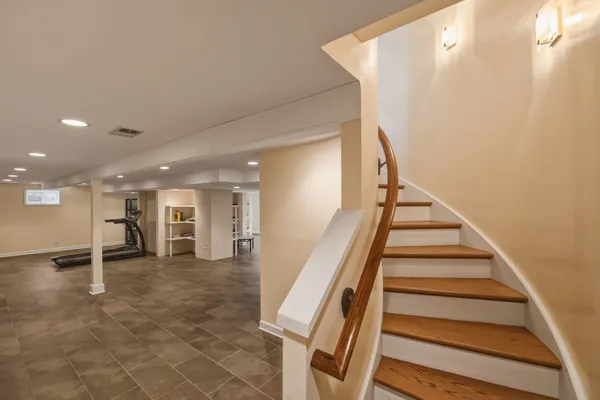 a view of a hallway with stairs