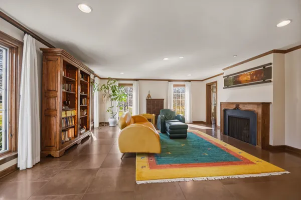 a living room with furniture rug and a fireplace