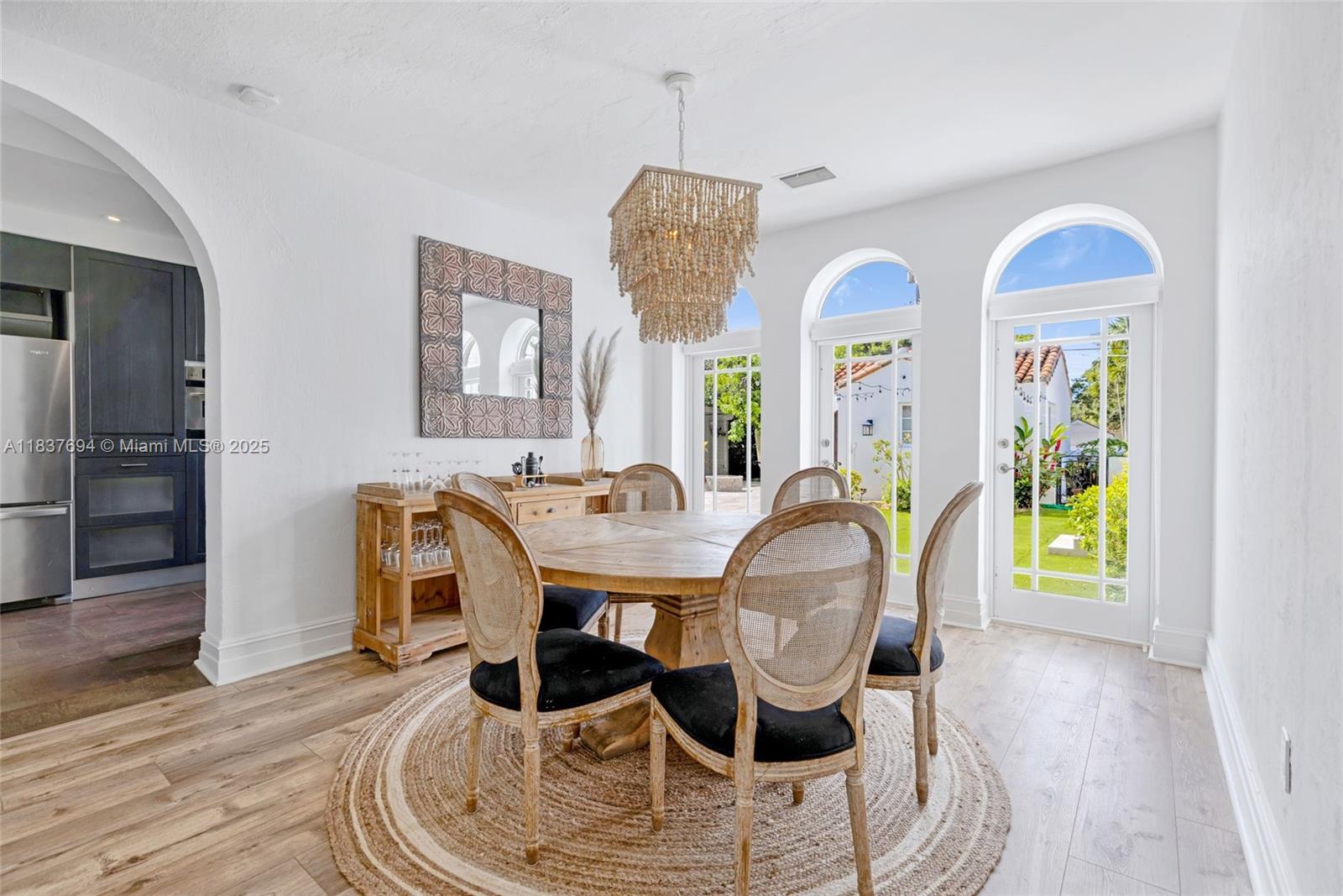 113 Northeast 101st Street Miami Shores, FL 33138 - Photo 11 of 56 a view of a dining room with furniture and wooden floor