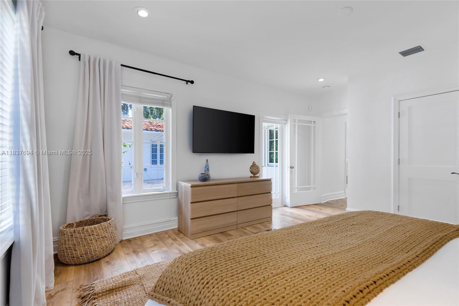 113 Northeast 101st Street Miami Shores, FL 33138 - Photo 21 of 56 a living room with furniture and a flat screen tv