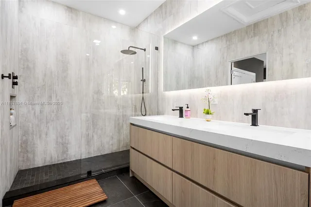 a bathroom with a toilet a sink and a mirror