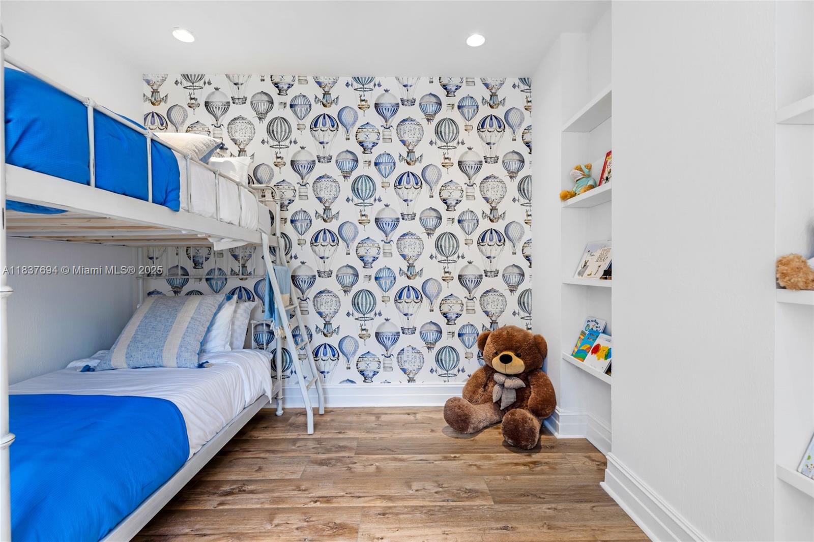 113 Northeast 101st Street Miami Shores, FL 33138 - Photo 32 of 56 a bedroom with a bed and a window