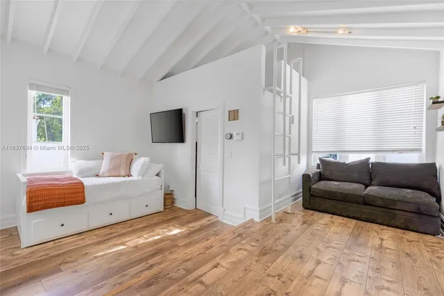a view of a patio with a table and chairs