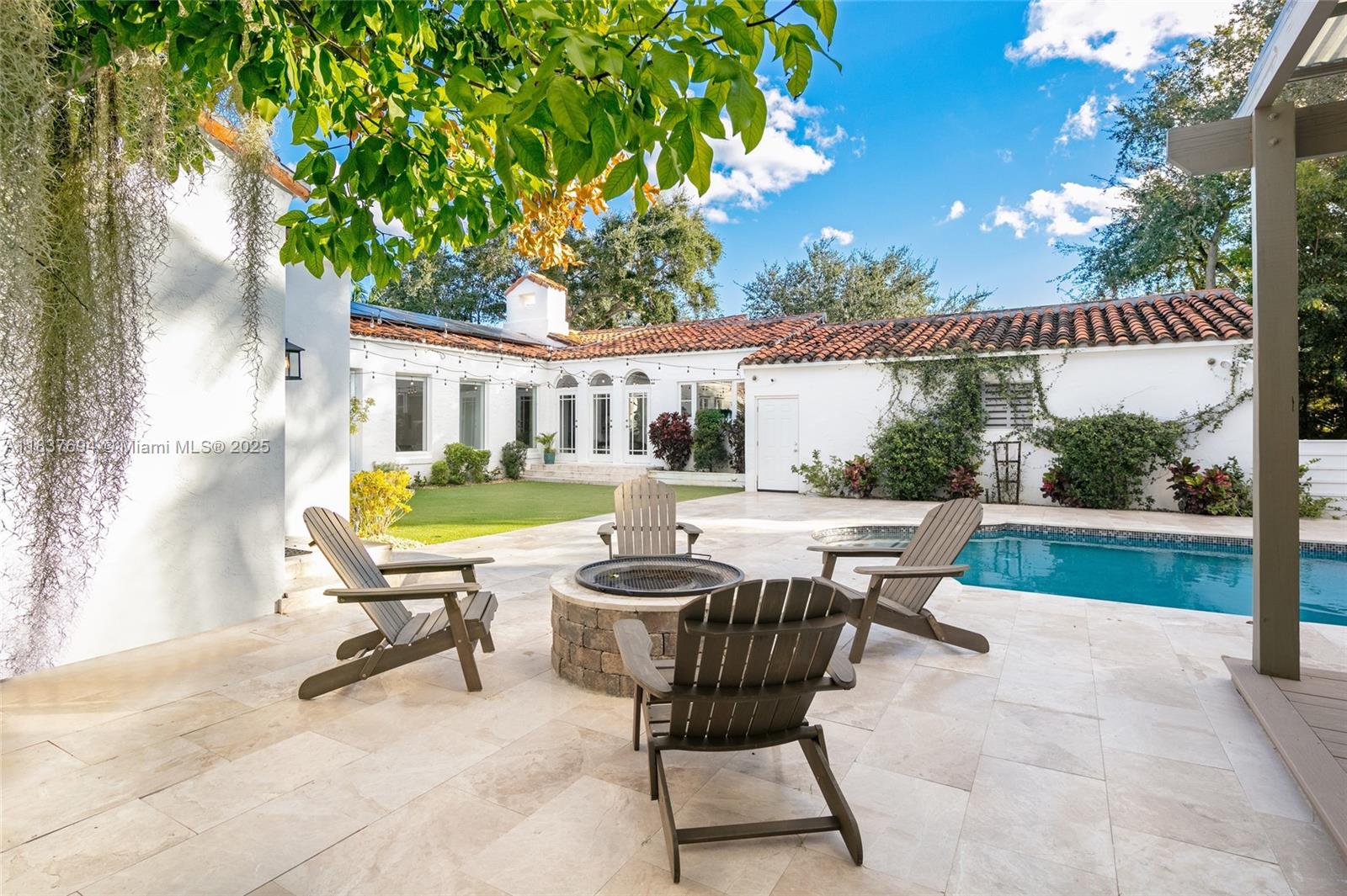 113 Northeast 101st Street Miami Shores, FL 33138 - Photo 41 of 56 a view of a patio with table and chairs and potted plants