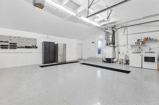 an aerial view of residential house with outdoor space and swimming pool