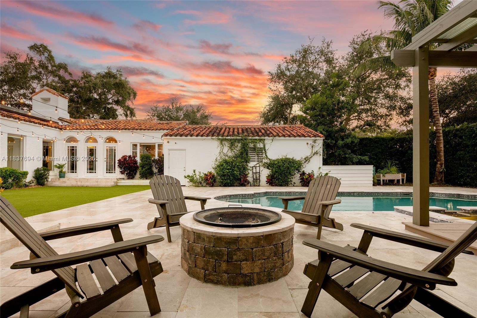 113 Northeast 101st Street Miami Shores, FL 33138 - Photo 51 of 56 a view of a patio with table and chairs and potted plants