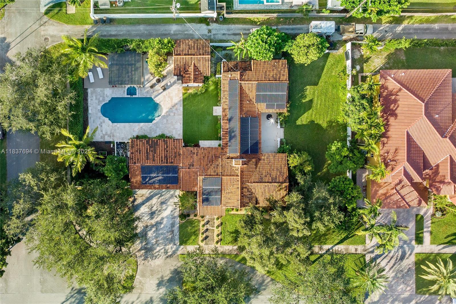 113 Northeast 101st Street Miami Shores, FL 33138 - Photo 52 of 56 an aerial view of residential house with outdoor space and swimming pool