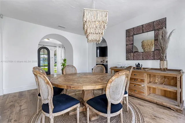 a kitchen with stainless steel appliances a sink stove and cabinets