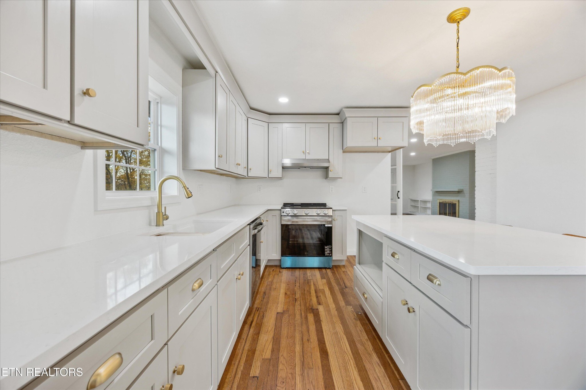 100 Pearl Road Oak Ridge, TN 37830 - Photo 13 of 37 a kitchen with cabinets a sink and appliances