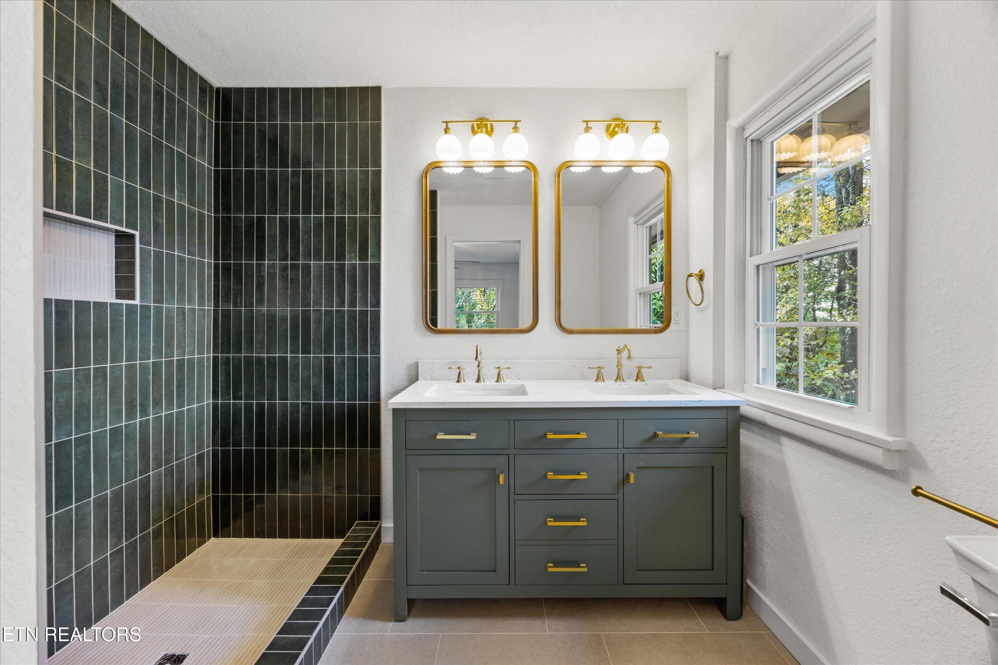 100 Pearl Road Oak Ridge, TN 37830 - Photo 19 of 37 a bathroom with a sink mirror and a shower