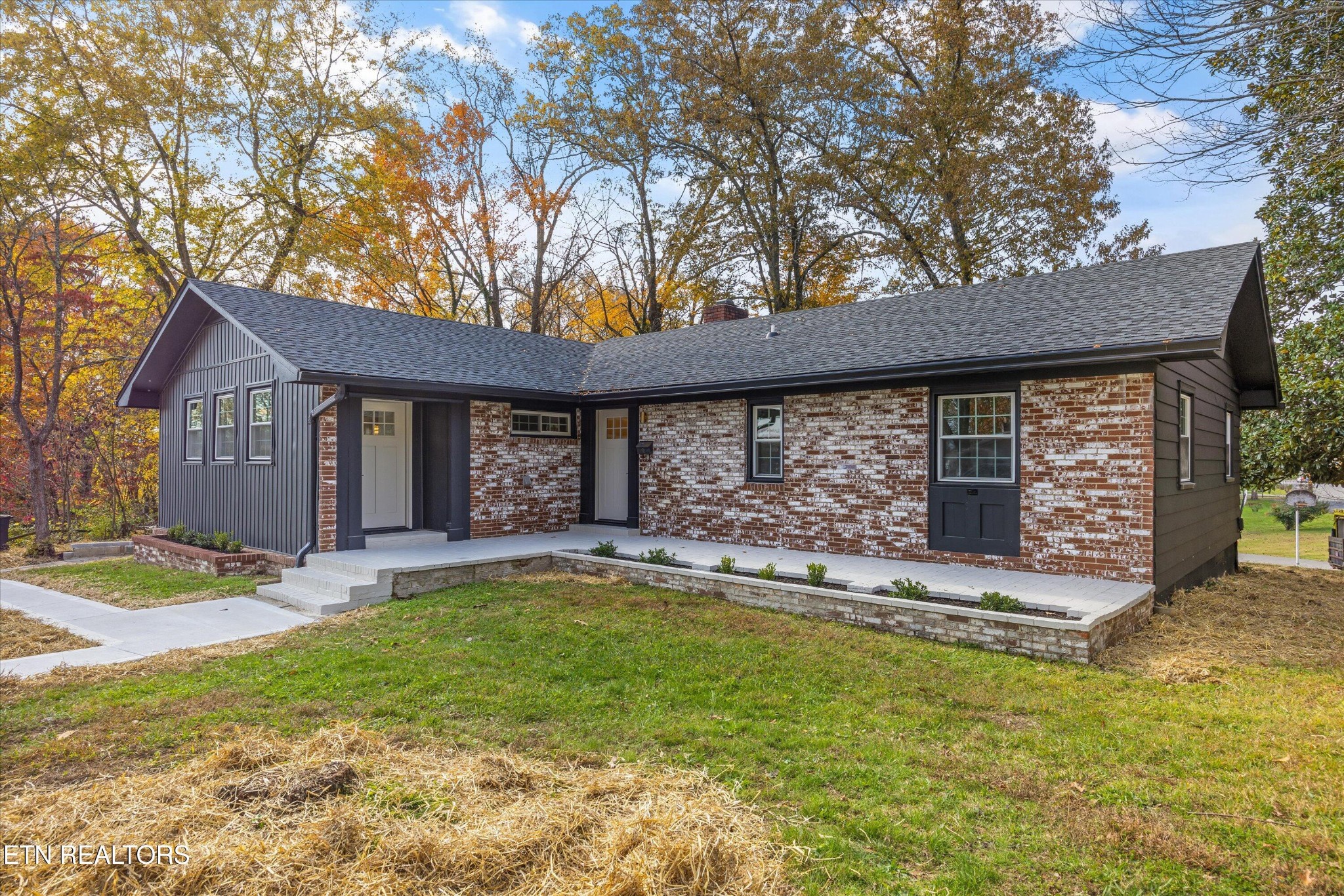 100 Pearl Road Oak Ridge, TN 37830 - Photo 2 of 37 a view of a house with backyard and sitting area