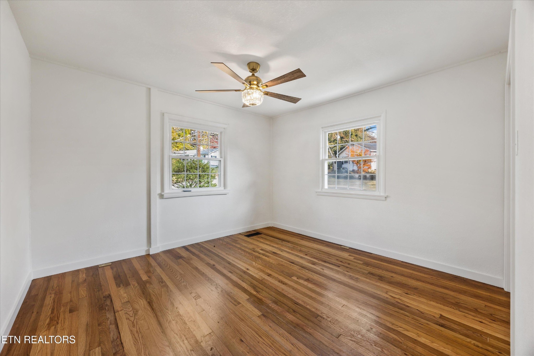 100 Pearl Road Oak Ridge, TN 37830 - Photo 22 of 37 a view of empty room with wooden floor