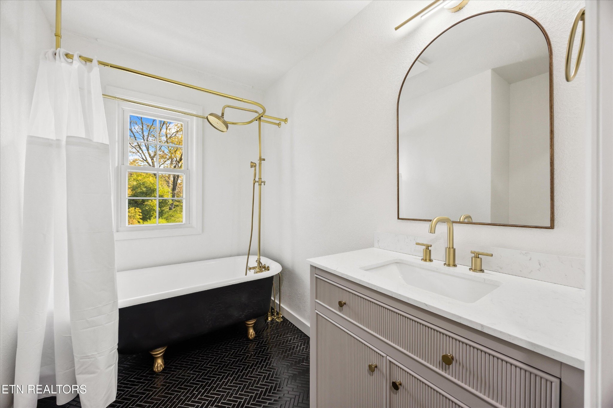 100 Pearl Road Oak Ridge, TN 37830 - Photo 25 of 37 a bathroom with a sink a toilet and a mirror
