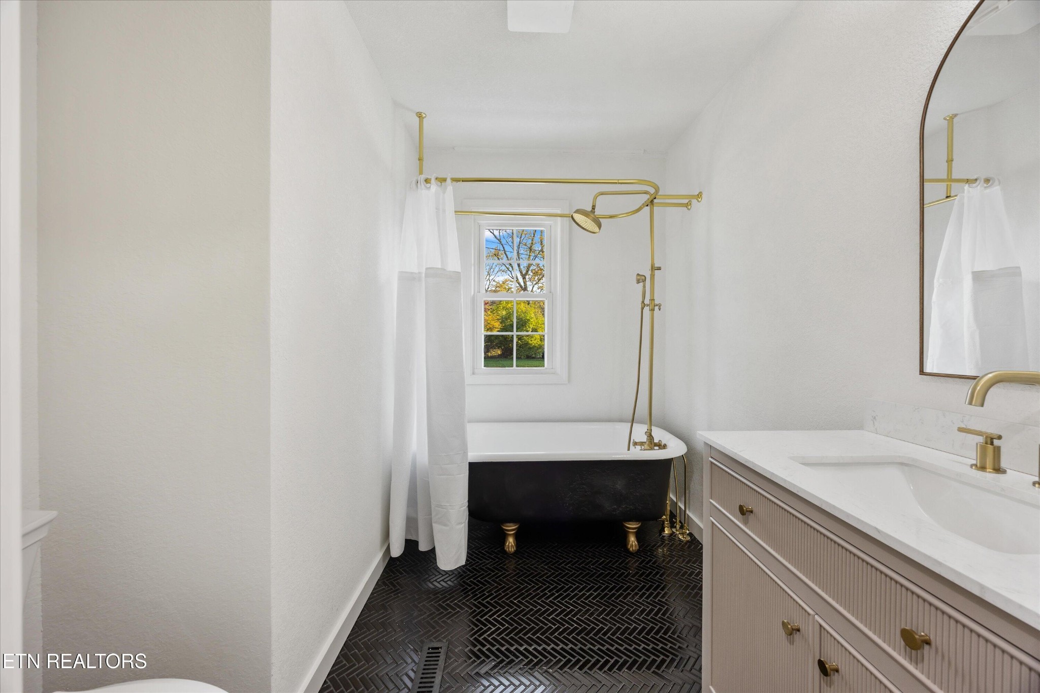 100 Pearl Road Oak Ridge, TN 37830 - Photo 26 of 37 a bathroom with a sink and a mirror