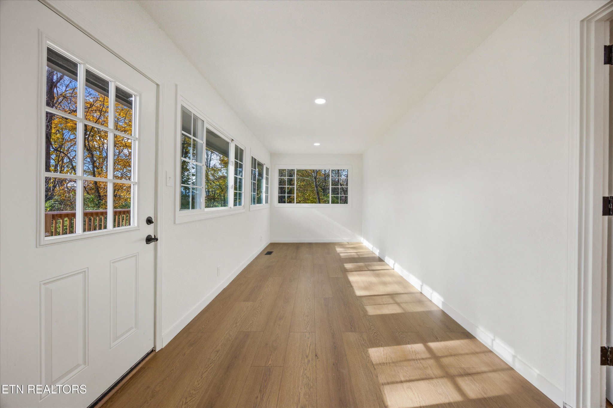100 Pearl Road Oak Ridge, TN 37830 - Photo 28 of 37 a view of a hallway with wooden floor and windows