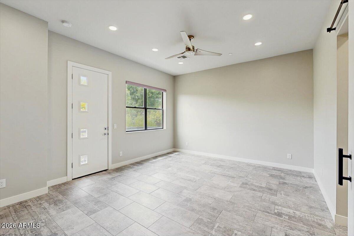2645 East Osborn Road, Unit 3 Phoenix, AZ 85016 - Photo 5 of 14 a view of an empty room with a window