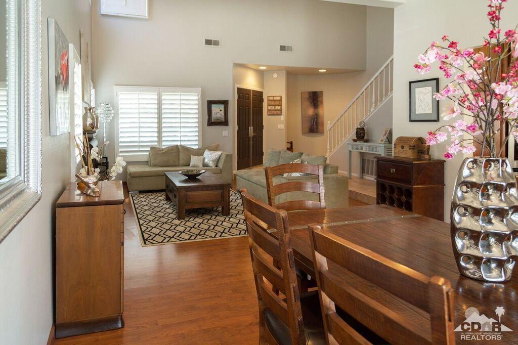 41310 Carlotta Drive Palm Desert, CA 92211 - Photo 19 of 32 a living room with furniture and wooden floor