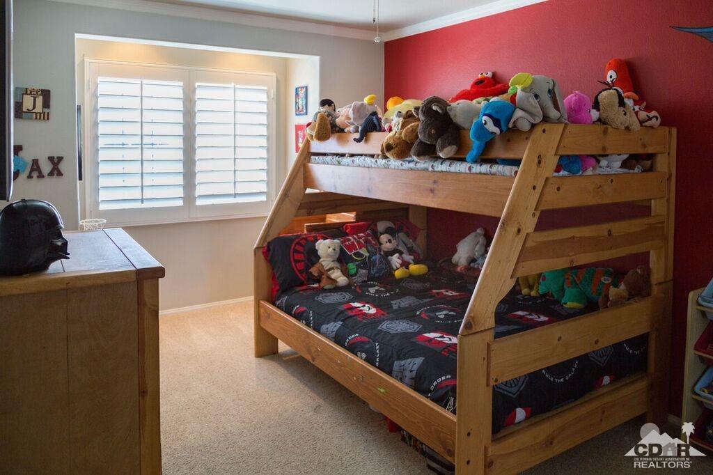 41310 Carlotta Drive Palm Desert, CA 92211 - Photo 20 of 32 a bed room with a bed and a window