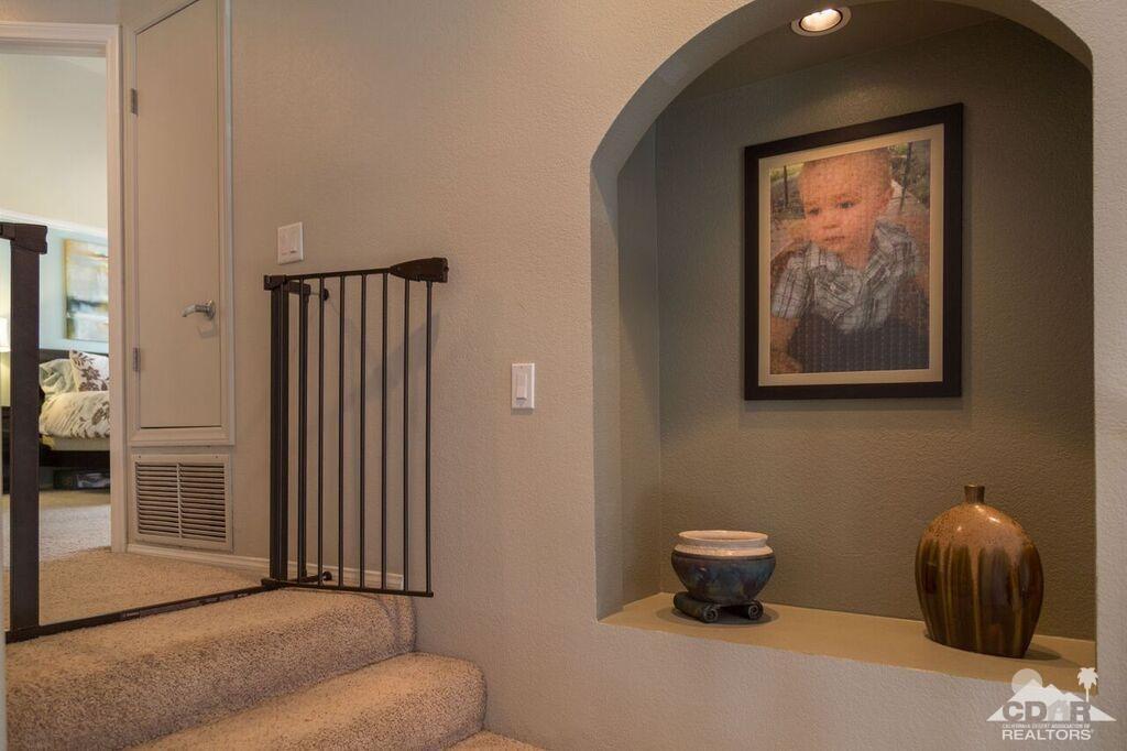 41310 Carlotta Drive Palm Desert, CA 92211 - Photo 24 of 32 a living room with furniture and a window