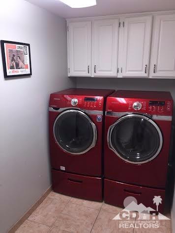 41310 Carlotta Drive Palm Desert, CA 92211 - Photo 26 of 32 a utility room with mirror and washer