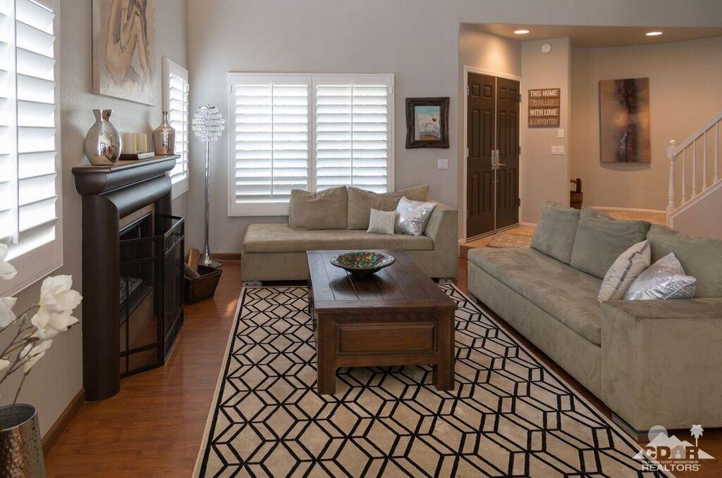 41310 Carlotta Drive Palm Desert, CA 92211 - Photo 5 of 32 a living room with furniture and a fireplace