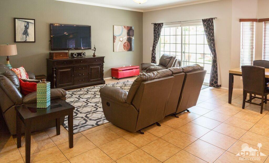 41310 Carlotta Drive Palm Desert, CA 92211 - Photo 6 of 32 a living room with furniture and a flat screen tv