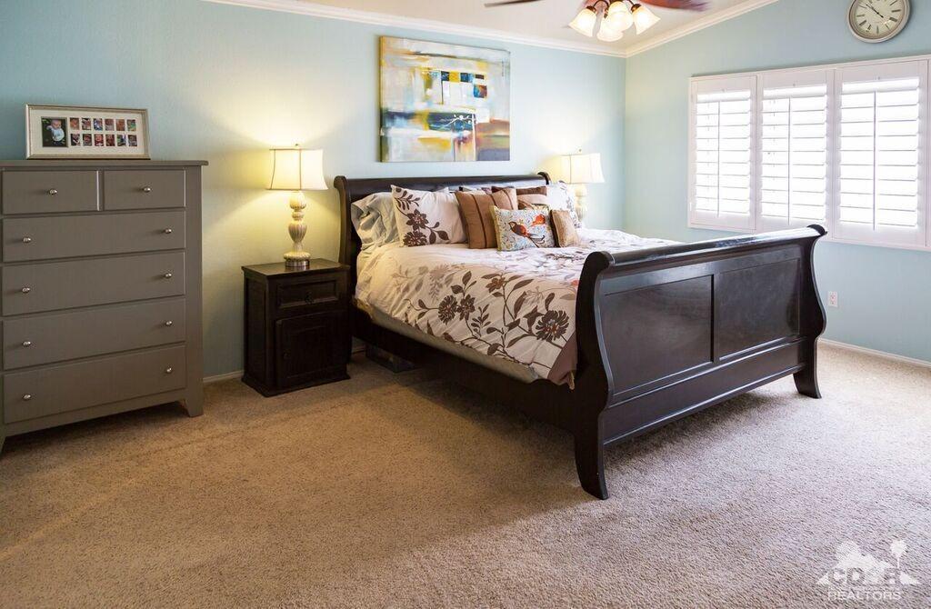 41310 Carlotta Drive Palm Desert, CA 92211 - Photo 8 of 32 a bed sitting in a bedroom next to a window