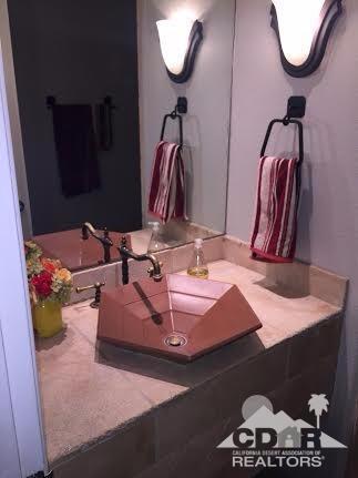 41310 Carlotta Drive Palm Desert, CA 92211 - Photo 10 of 32 a bathroom with a sink and a mirror
