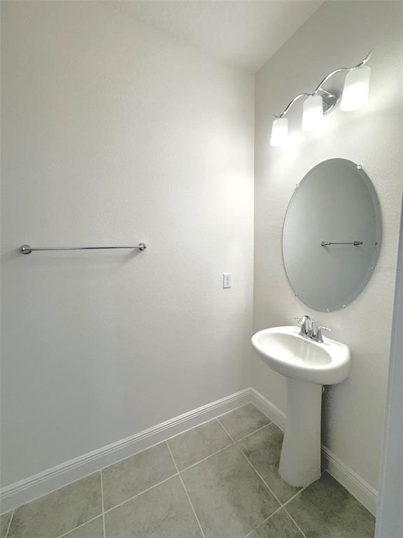 4826 Prairie Preserve Run St. Cloud, FL 34772 - Photo 13 of 44 a bathroom with a sink toilet and mirror