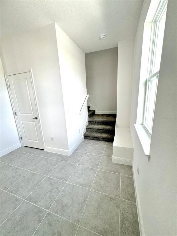 4826 Prairie Preserve Run St. Cloud, FL 34772 - Photo 15 of 44 a view of an entryway with staircase