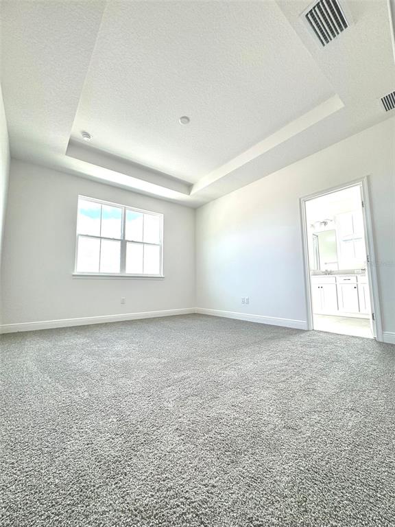 4826 Prairie Preserve Run St. Cloud, FL 34772 - Photo 18 of 44 an empty room with windows