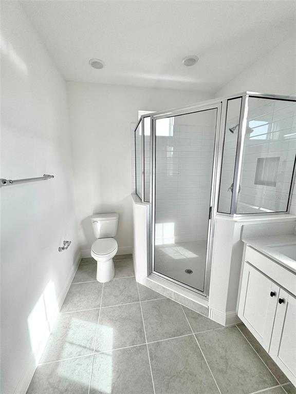 4826 Prairie Preserve Run St. Cloud, FL 34772 - Photo 20 of 44 a bathroom with a toilet and a shower