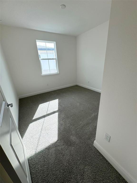 4826 Prairie Preserve Run St. Cloud, FL 34772 - Photo 24 of 44 an empty room with windows