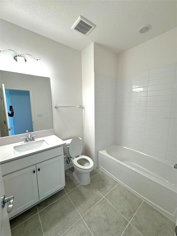 4826 Prairie Preserve Run St. Cloud, FL 34772 - Photo 30 of 44 a bathroom with a toilet sink and mirror