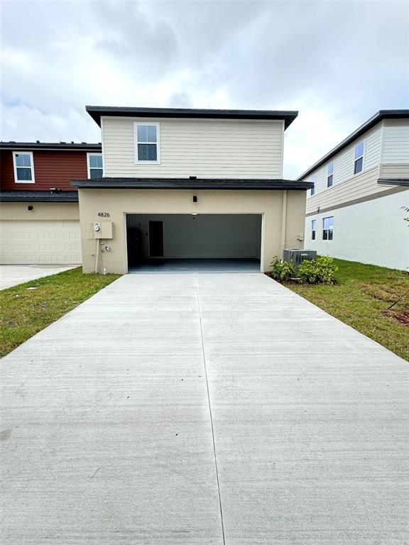 4826 Prairie Preserve Run St. Cloud, FL 34772 - Photo 34 of 44 a kitchen with a cabinets and a stove top oven