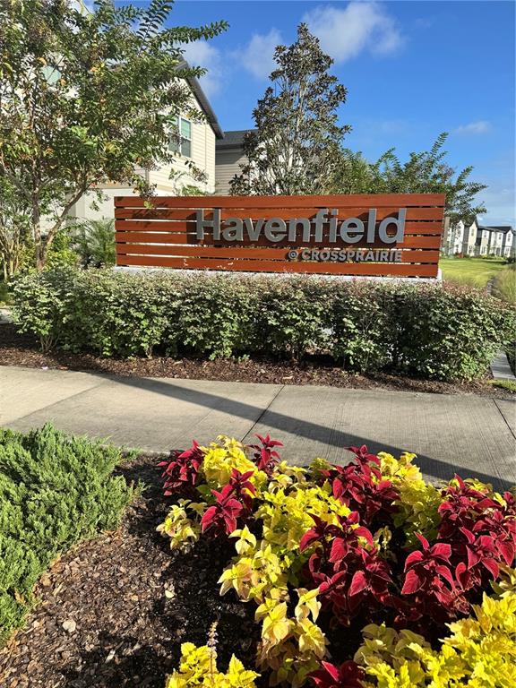 4826 Prairie Preserve Run St. Cloud, FL 34772 - Photo 4 of 44 a sign that is in front of flowers