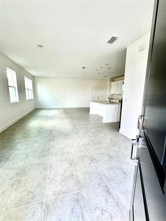 4826 Prairie Preserve Run St. Cloud, FL 34772 - Photo 5 of 44 a view of a kitchen with furniture and a window