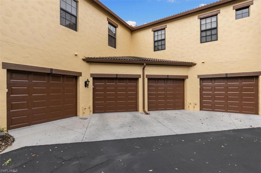 8985 Cambria Circle, Unit 211 Naples, FL 34113 - Photo 25 of 41 a front view of a house